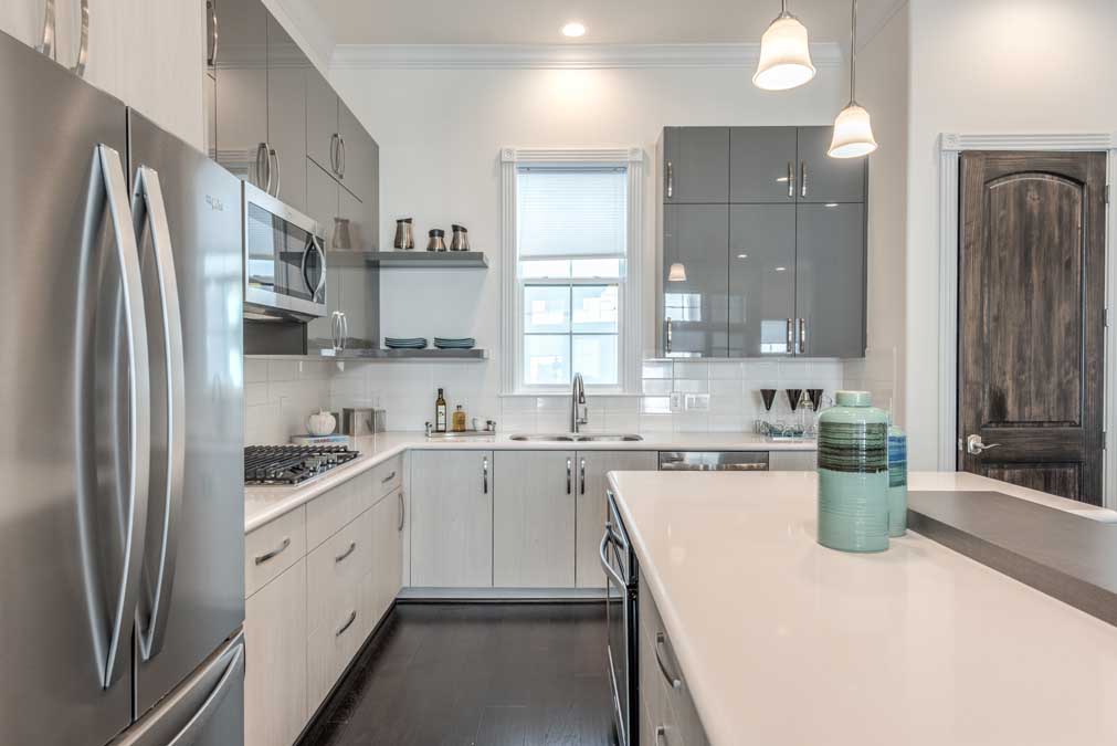 Kitchens feature 54-inch cabinets and brushed nickel finishes.   