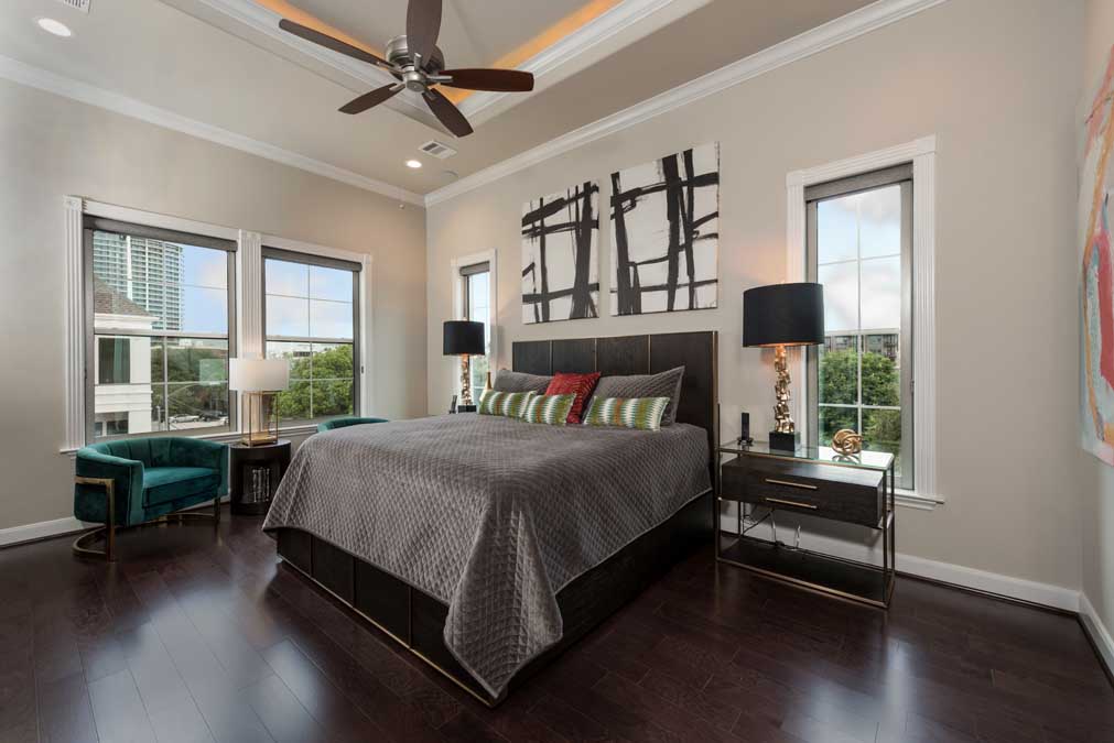 Master bedroom with plenty of natural light and 11-foot ceilings.